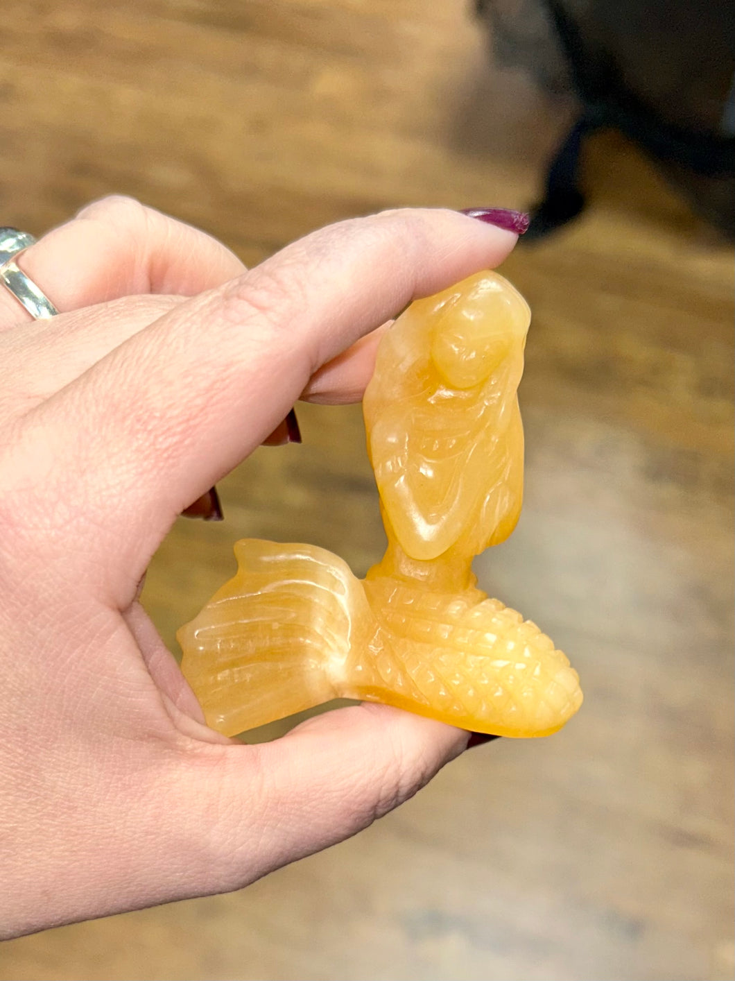 Orange calcite mermaid